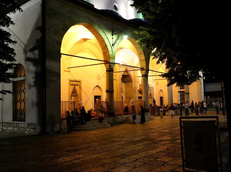 Sarajevo: Nighttime City Highlights Walking Tour - Sarajevo City Hall, Inat kuća, and the market lanes where daily life shows up